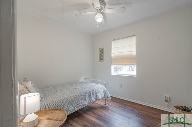 bedroom featuring ceiling fan and dark hardwood / wood-style floors