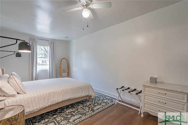 bedroom featuring dark hardwood / wood-style floors and ceiling fan