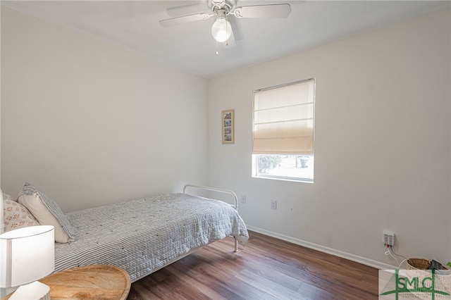 bedroom featuring hardwood / wood-style floors and ceiling fan