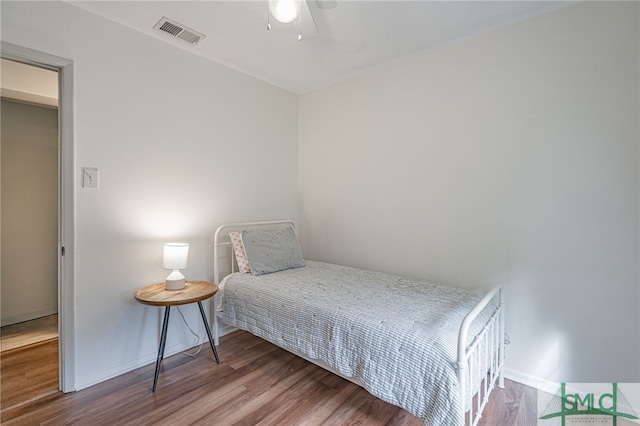 bedroom with hardwood / wood-style flooring and ceiling fan