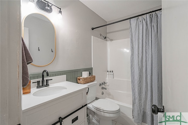 full bathroom featuring tile patterned flooring, shower / tub combo, vanity, and toilet