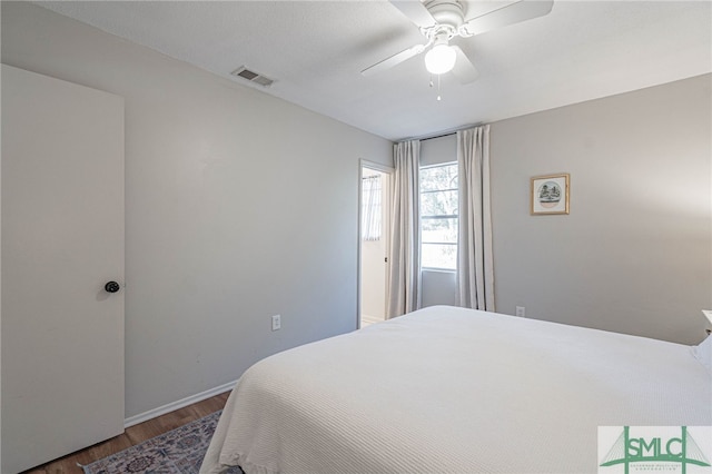 bedroom featuring hardwood / wood-style floors and ceiling fan