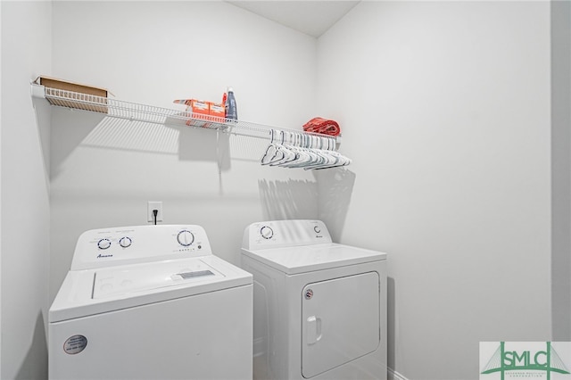 washroom featuring independent washer and dryer