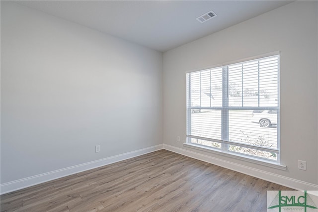 unfurnished room featuring light wood-type flooring