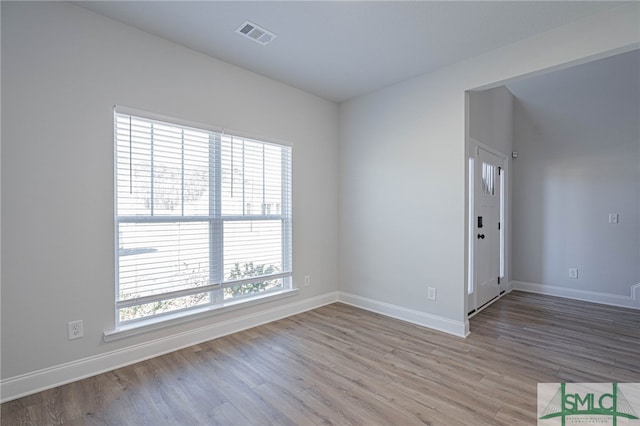 unfurnished room featuring light hardwood / wood-style floors