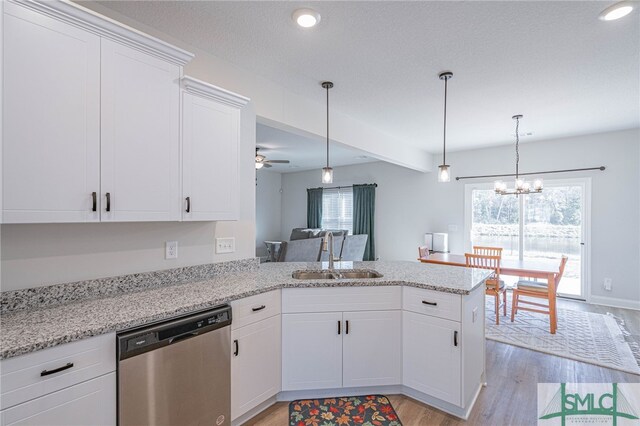 kitchen featuring dishwasher, white cabinetry, kitchen peninsula, and sink