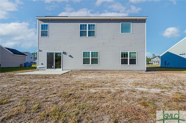 rear view of house with a patio