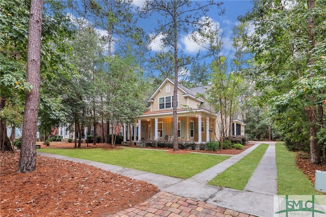 view of front of home with covered porch and a front yard