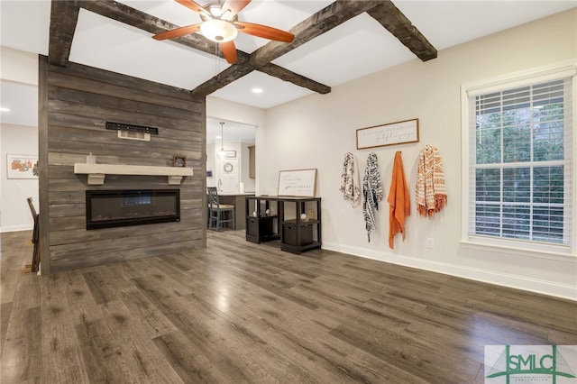 living room with beam ceiling, dark hardwood / wood-style floors, and ceiling fan