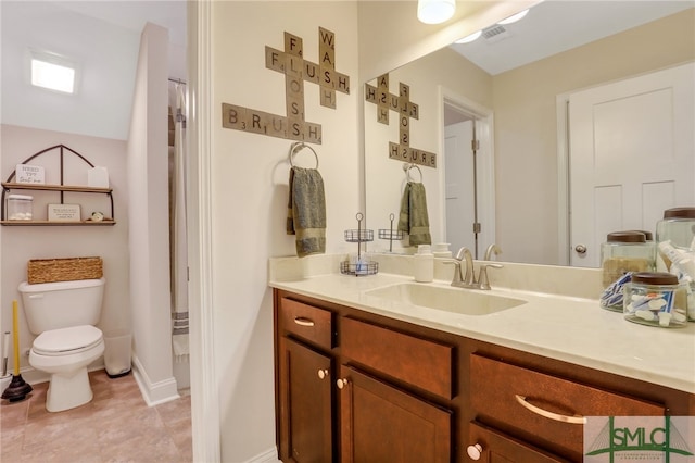 bathroom featuring vanity and toilet