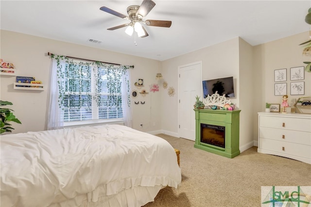 carpeted bedroom with ceiling fan