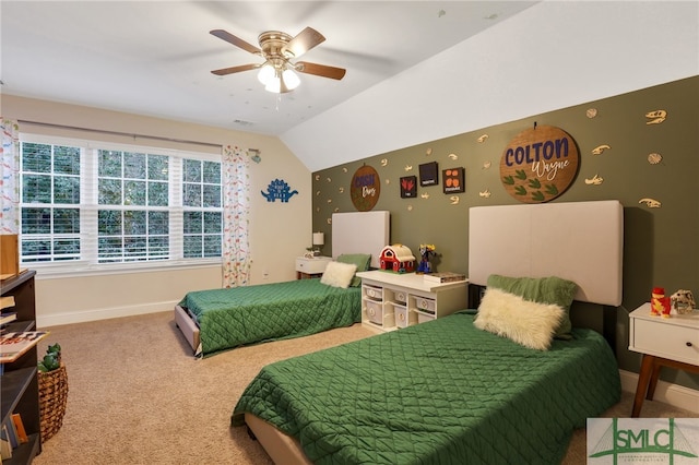 carpeted bedroom featuring ceiling fan and vaulted ceiling