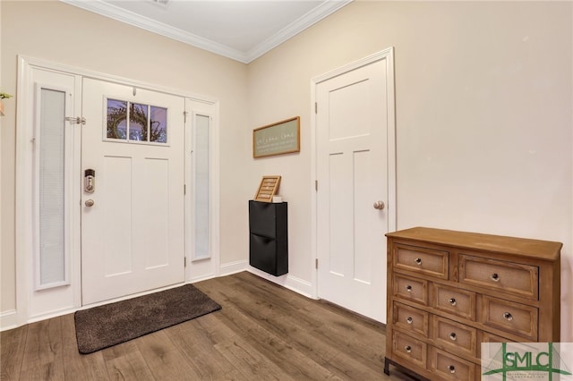 entrance foyer featuring dark hardwood / wood-style floors and ornamental molding