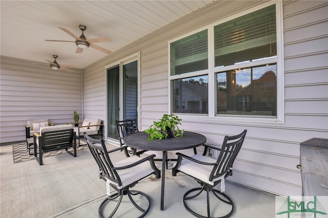 view of patio with an outdoor living space and ceiling fan