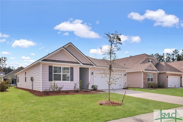 view of front of property with a garage and a front lawn