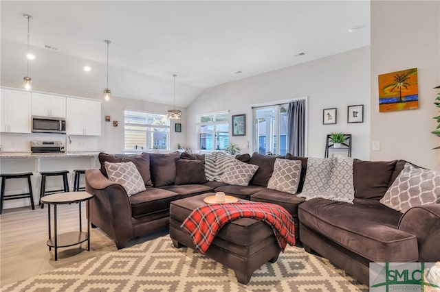 living room with lofted ceiling