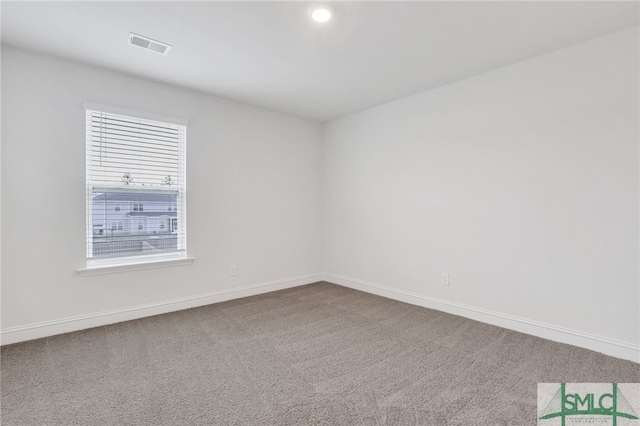 unfurnished room featuring carpet flooring