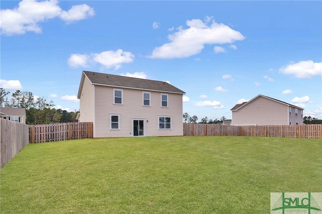 rear view of property with a lawn