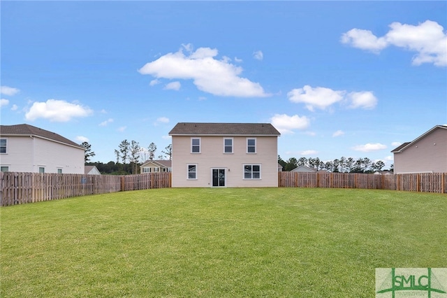 back of house featuring a lawn