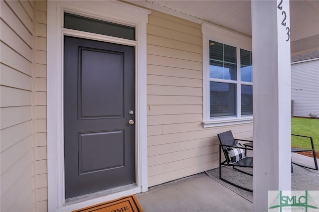 property entrance featuring covered porch