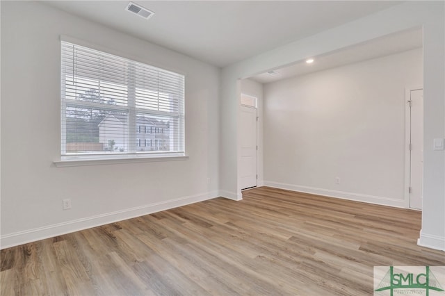 spare room featuring light hardwood / wood-style flooring