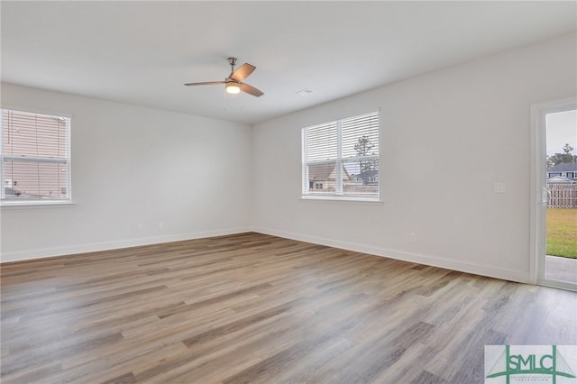 empty room featuring light hardwood / wood-style flooring and ceiling fan