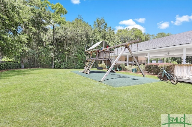 view of yard featuring a playground and ceiling fan