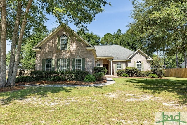 view of property featuring a front yard