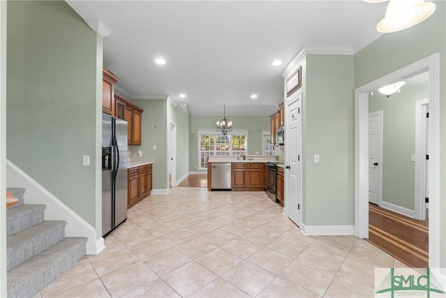 kitchen featuring brown cabinets, stainless steel appliances, crown molding, light countertops, and light tile patterned floors