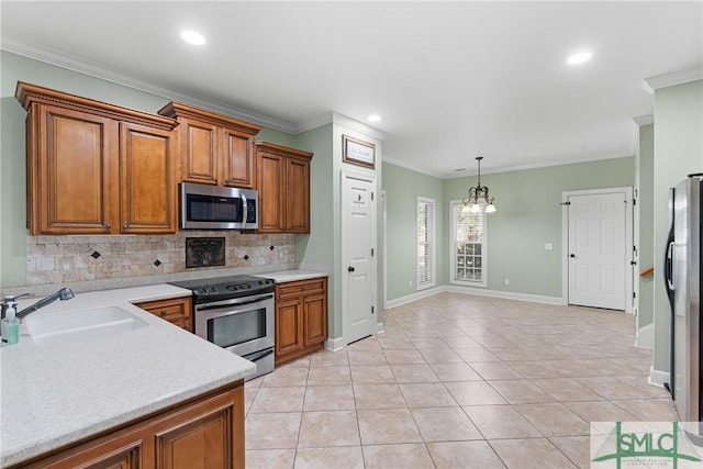 kitchen with a sink, stainless steel appliances, and brown cabinets