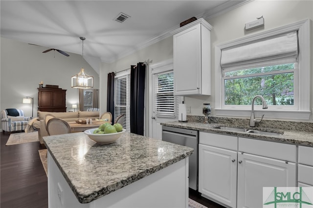 kitchen featuring white cabinets, dark hardwood / wood-style flooring, stainless steel dishwasher, and sink