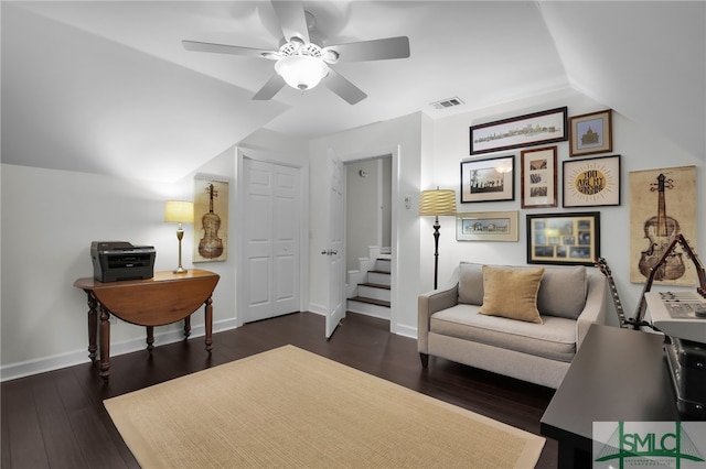 living area with dark hardwood / wood-style floors, vaulted ceiling, and ceiling fan