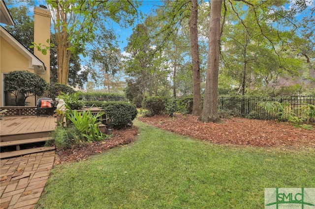 view of yard with a wooden deck