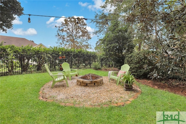 view of yard with a fire pit