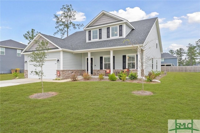 craftsman house with a front lawn, a porch, and a garage