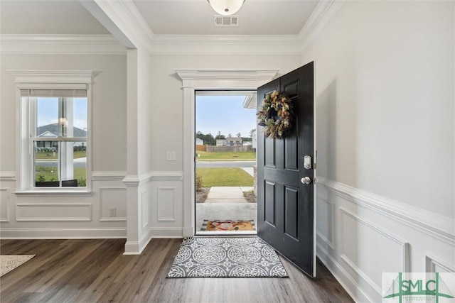 entryway featuring dark hardwood / wood-style floors and crown molding