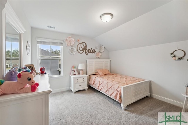 carpeted bedroom featuring vaulted ceiling