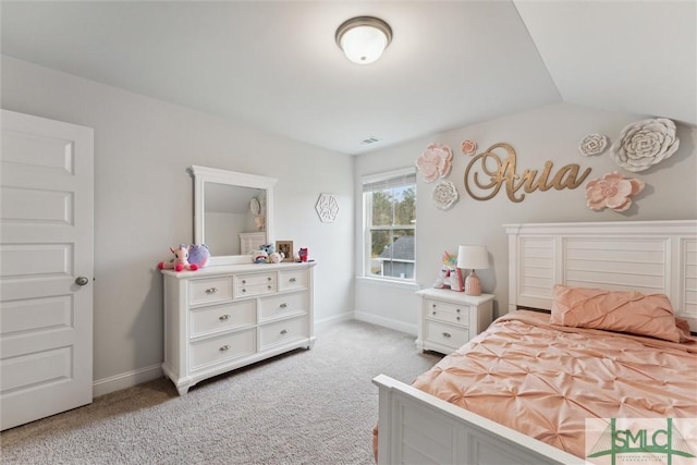 carpeted bedroom with lofted ceiling