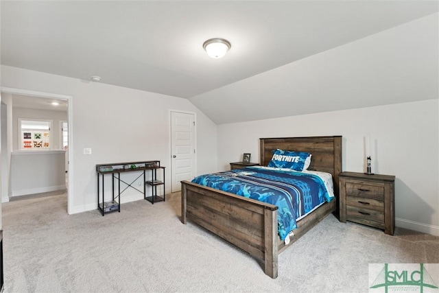 carpeted bedroom featuring vaulted ceiling