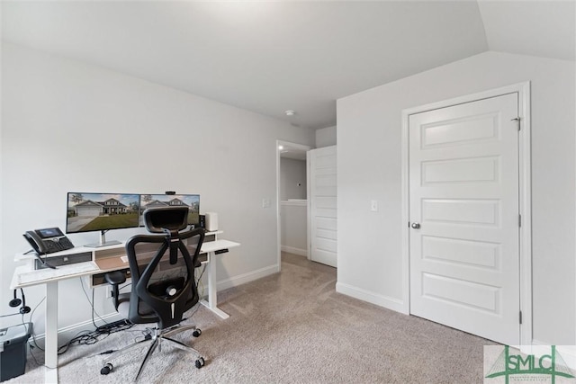 office space with light carpet and lofted ceiling