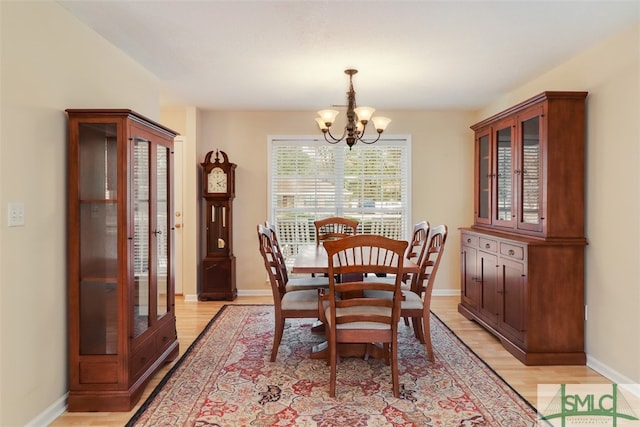 dining room featuring a chandelier and light hardwood / wood-style floors