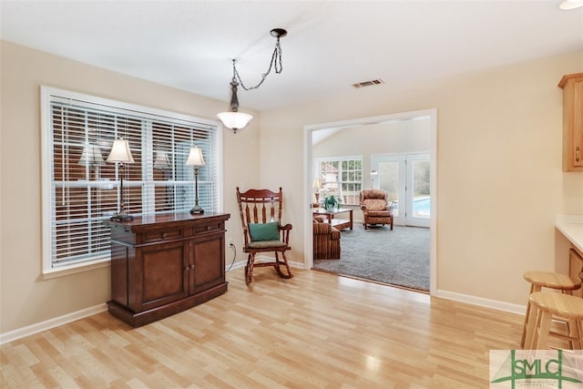 sitting room featuring light hardwood / wood-style flooring