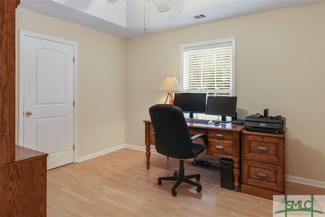 home office featuring ceiling fan and light hardwood / wood-style flooring