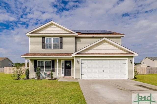 view of front of house featuring a front yard, solar panels, a porch, and a garage