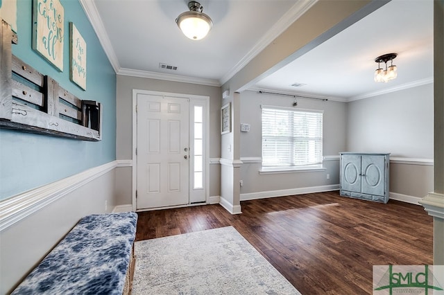 entrance foyer with dark hardwood / wood-style floors and crown molding