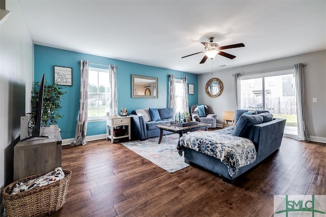 living room with ceiling fan and dark hardwood / wood-style floors