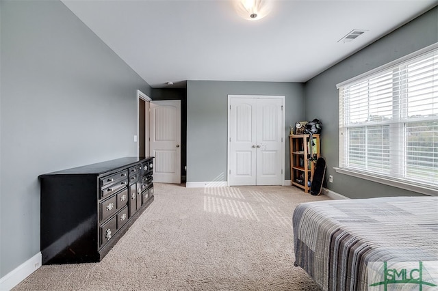 bedroom with light colored carpet