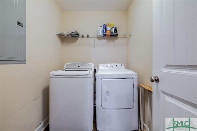 laundry area with electric panel, laundry area, and washing machine and clothes dryer