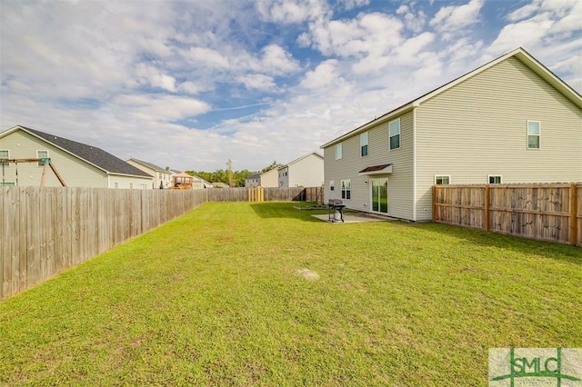 view of yard with a patio area, a residential view, and a fenced backyard