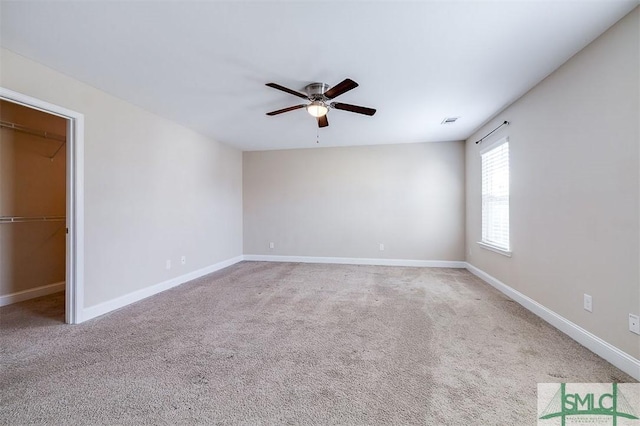 unfurnished bedroom featuring visible vents, carpet flooring, a ceiling fan, and baseboards